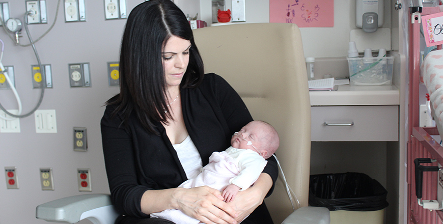 Jamie-Lee Eberts holds her baby daughter Olivia Eberts in the neonatal intensive care unit.