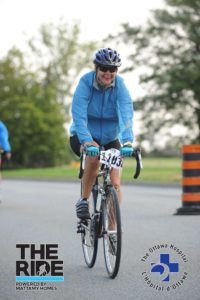 Donna Jakowec riding bike for cancer research charity