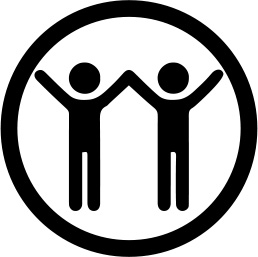 two volunteers standing together with hands held high
