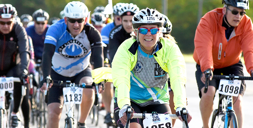 THE RIDE participants cycle toward the finish line