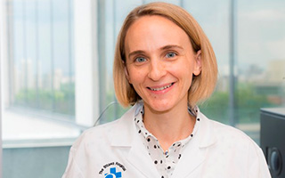 Dr. Marjorie Brand in a lab coat