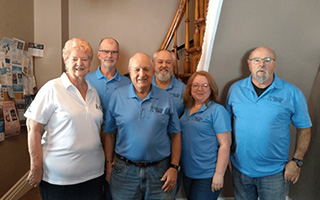 Tom (centre) and his wife, Janet (far left) with members of the 
Eastern Ontario Prostate Cancer Awareness Committe