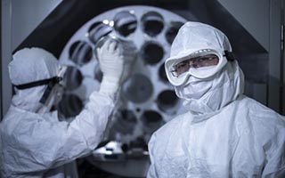 Staff use a bioreactor to grow cells inside the Biotherapeutics Manufacturing Centre