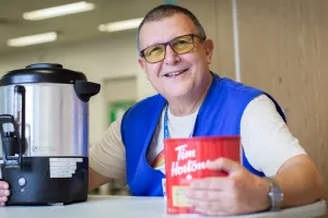 Claude serves coffee and companionship at the Rehabilitation Centre