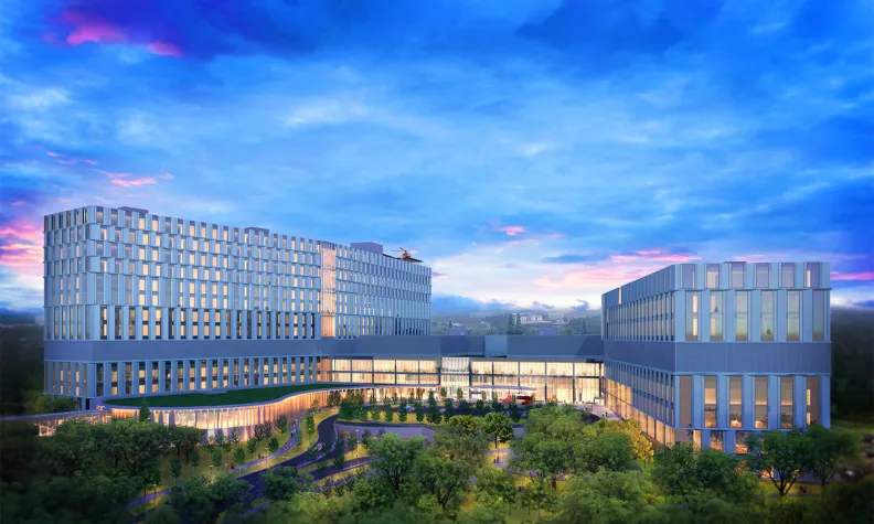 An artist rendering of The Ottawa Hospital’s new campus at dusk, showing the exterior main entrance of the hospital and trees in the foreground.