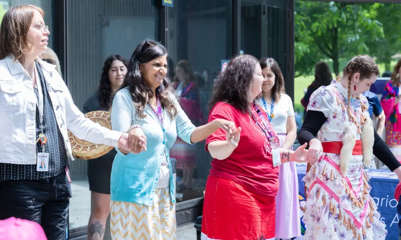 The Ontario Native Women’s Association leads a round dance, a ceremony that brings people together to heal and celebrate life.