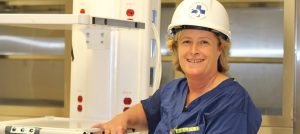 Nurse dons hard hat, steel-toed construction shoes for ‘clinical’ work