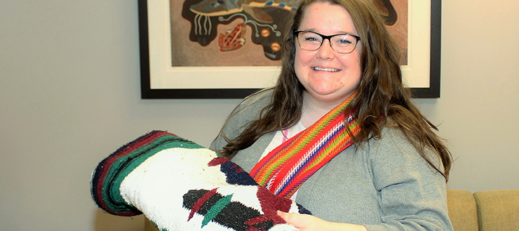 Megan Ellis, Aboriginal Program Coordinator, wears her red sash to show her Métis heritage