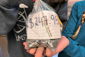 $247.95 worth money bag raised by six 11 year old kids