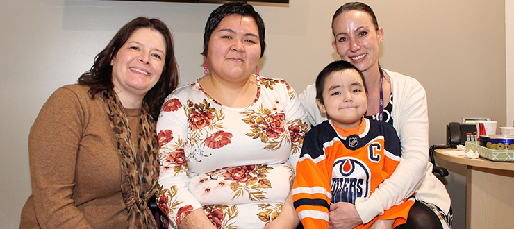 Nina Kautuq (centre) and six-year-old son Jutanie, . Carolyn Roberts (left), and Kerri-Lynn Whyte (right)