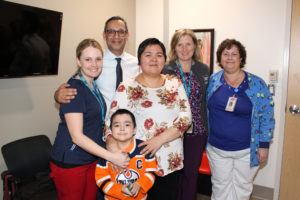 CHEO staff in the Pediatric Intensive Care Unit meeting Nina Kautuq (centre) and son Jutanie. Brooke Akeson (left), Dr. Sonny Dhanani (back), Carol Ernewein, Suzanne Guay (right) and Kim Seguin (who joined the meeting by FaceTime)