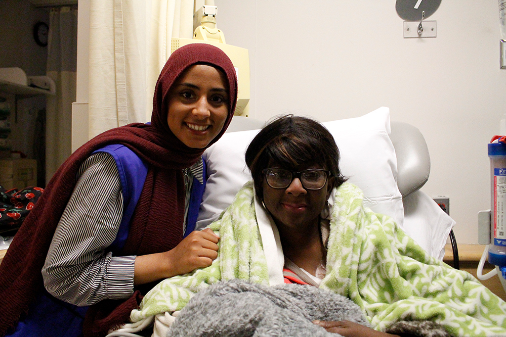 Sarah Aly with a patient 