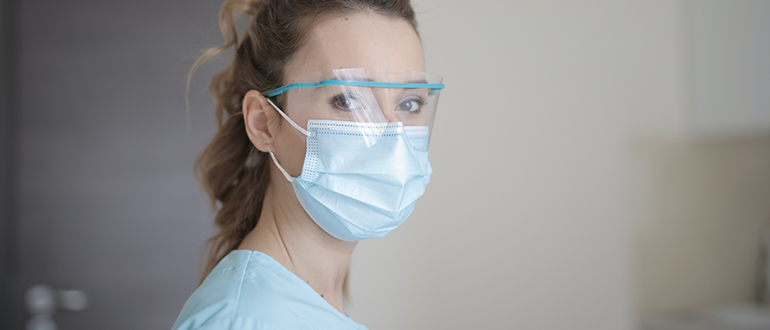 Woman with a mask on her face.