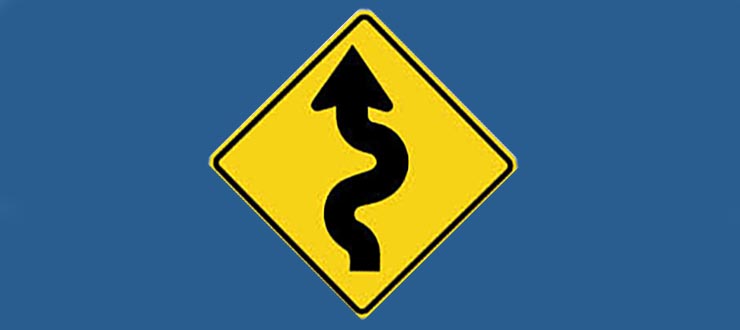 Road sign: winding road ahead