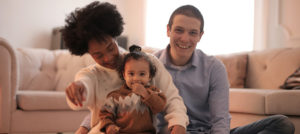 Family sitting on floor at home