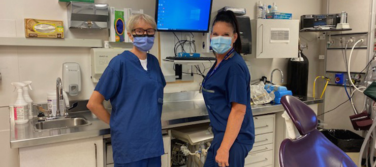 Two members of the dental clinic standing in a dental exam room at The Ottawa Hospital.