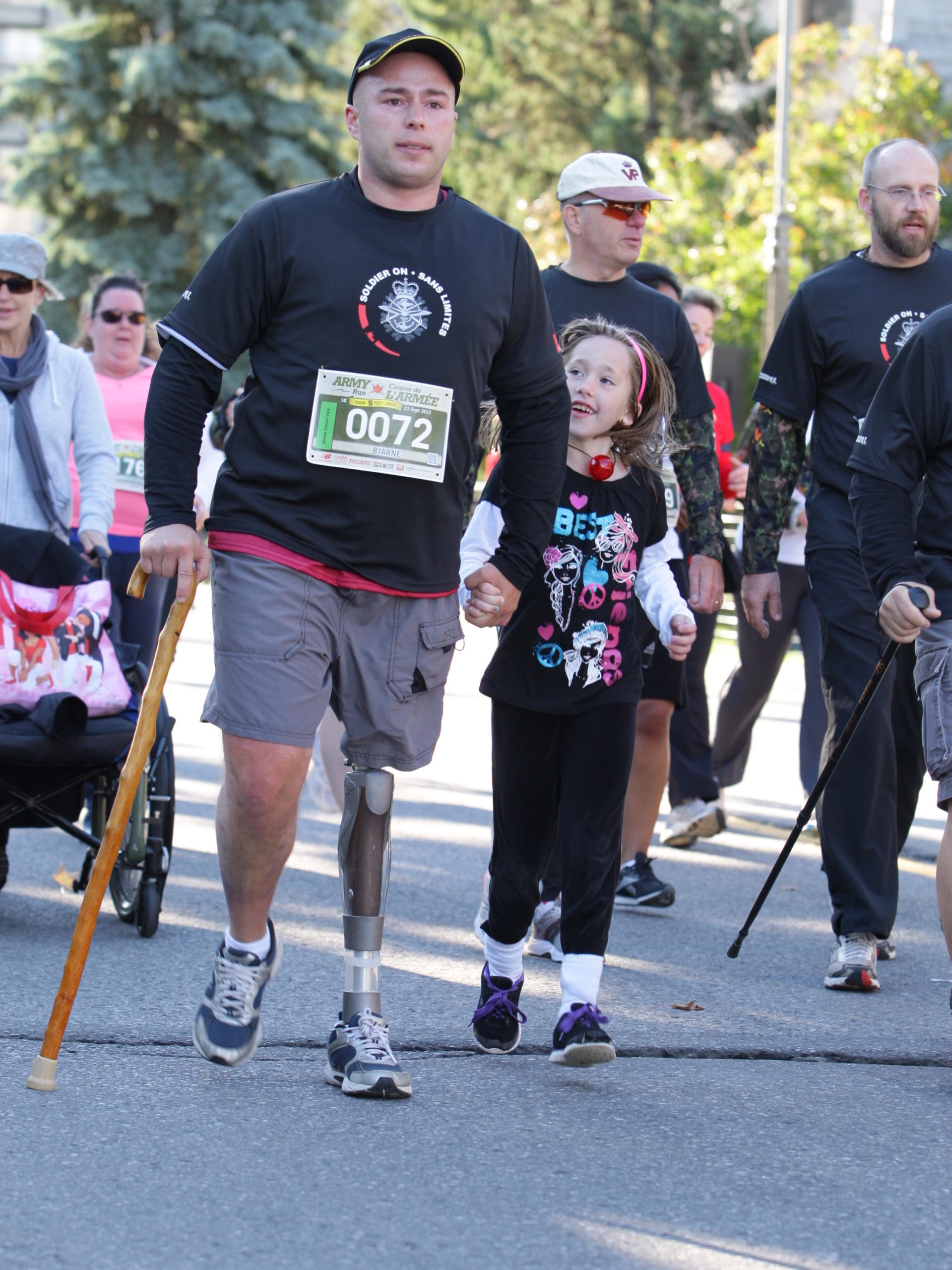 Bjarne Nielsen (left foreground) and his daughter participating in the Army Run 