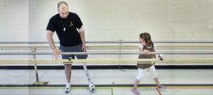 Bjarne Nielsen (left) and his daughter in the rehabilitation gym