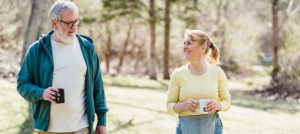 Two seniors walking outside