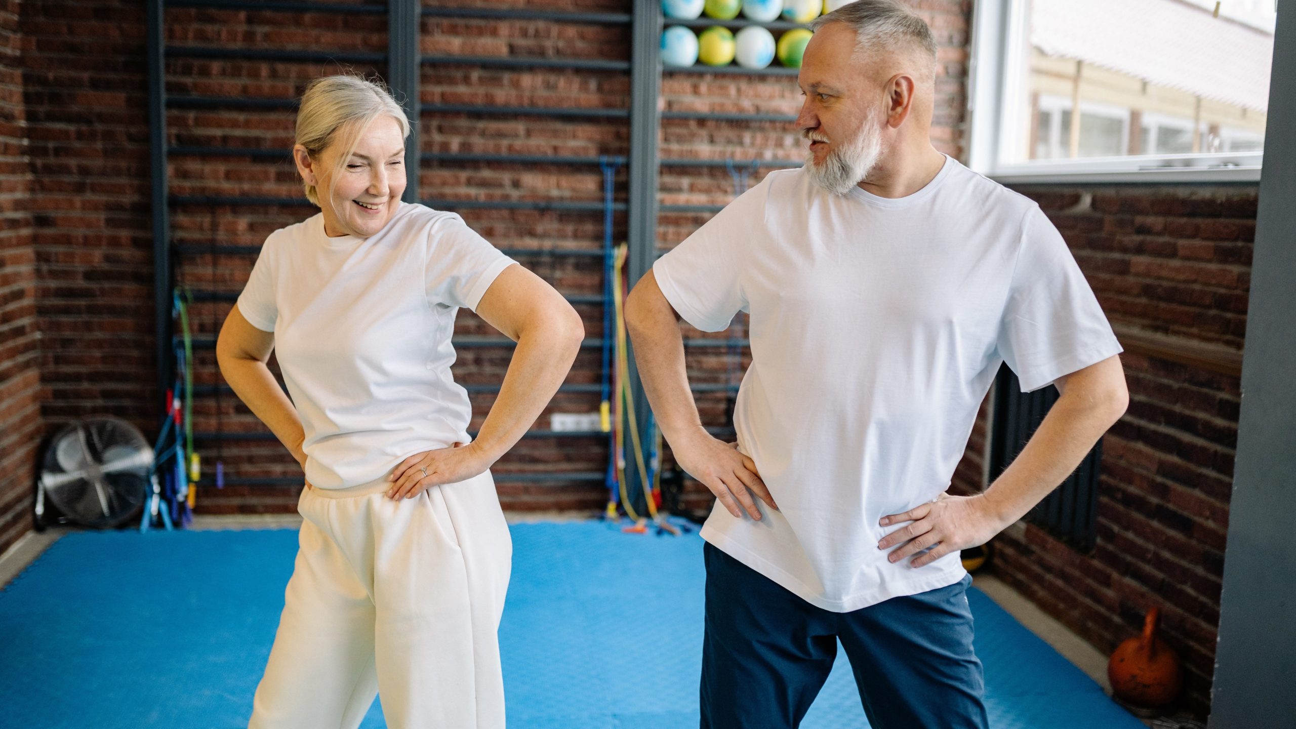 Two seniors exercising