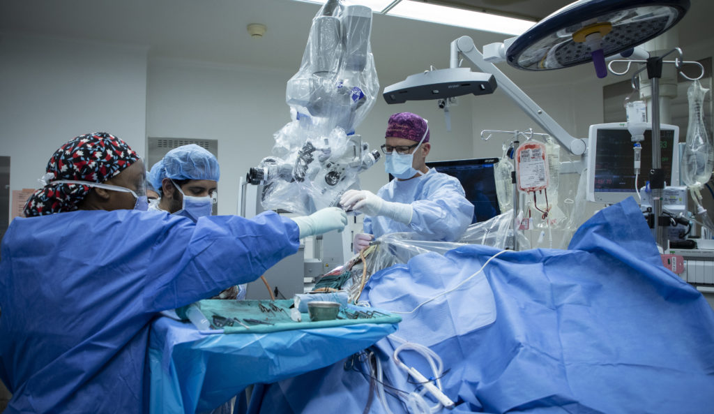 People performing surgery in an operating room
