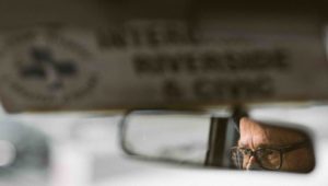 Bill Nauffts eyes reflected in the rear-view mirror of his bus