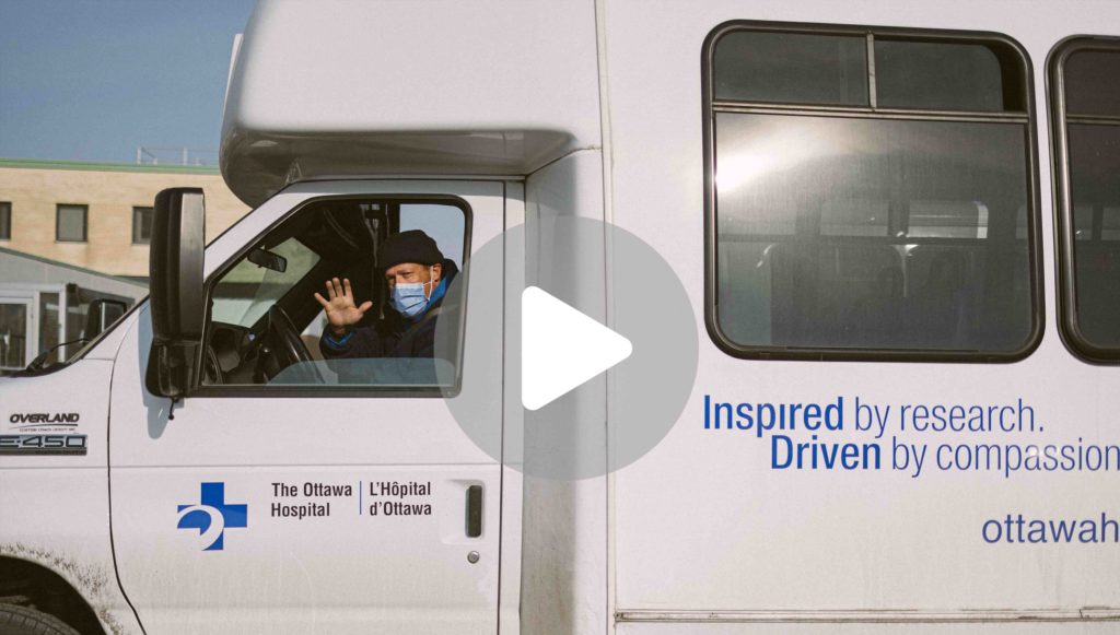 Video thumbnail: Bill Nauffts waving while sitting in the driver seat of his shuttle bus.