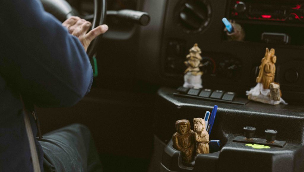 Bill’s carved figurines sitting in cupholders