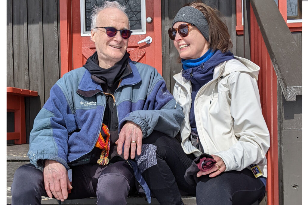 Don Wismer [left] and Bernice Wright [right] sitting on some steps