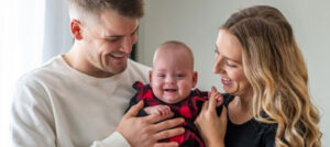 Emmy at home with her parents Mike Cogan and Alicia Racine (November 2023).