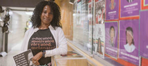 Registered Nurse Macrina Valcin showcases her Black History Month display at the General Campus.