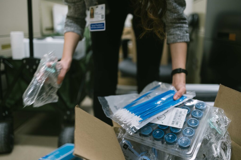 Sarah organizes some Pap test kits