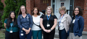Members of the Robin Easey Centre team pose outside the Centre.